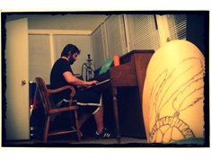 Ryan playing the Henry F. Miller. (photo taken by Holly M. - that is her tattoo in the foreground btw)