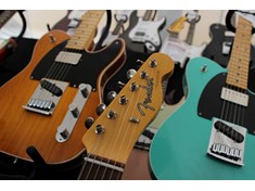 A wall of Fender Guitars.