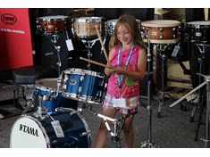 Possibly a future drummer playing a Tama kit.